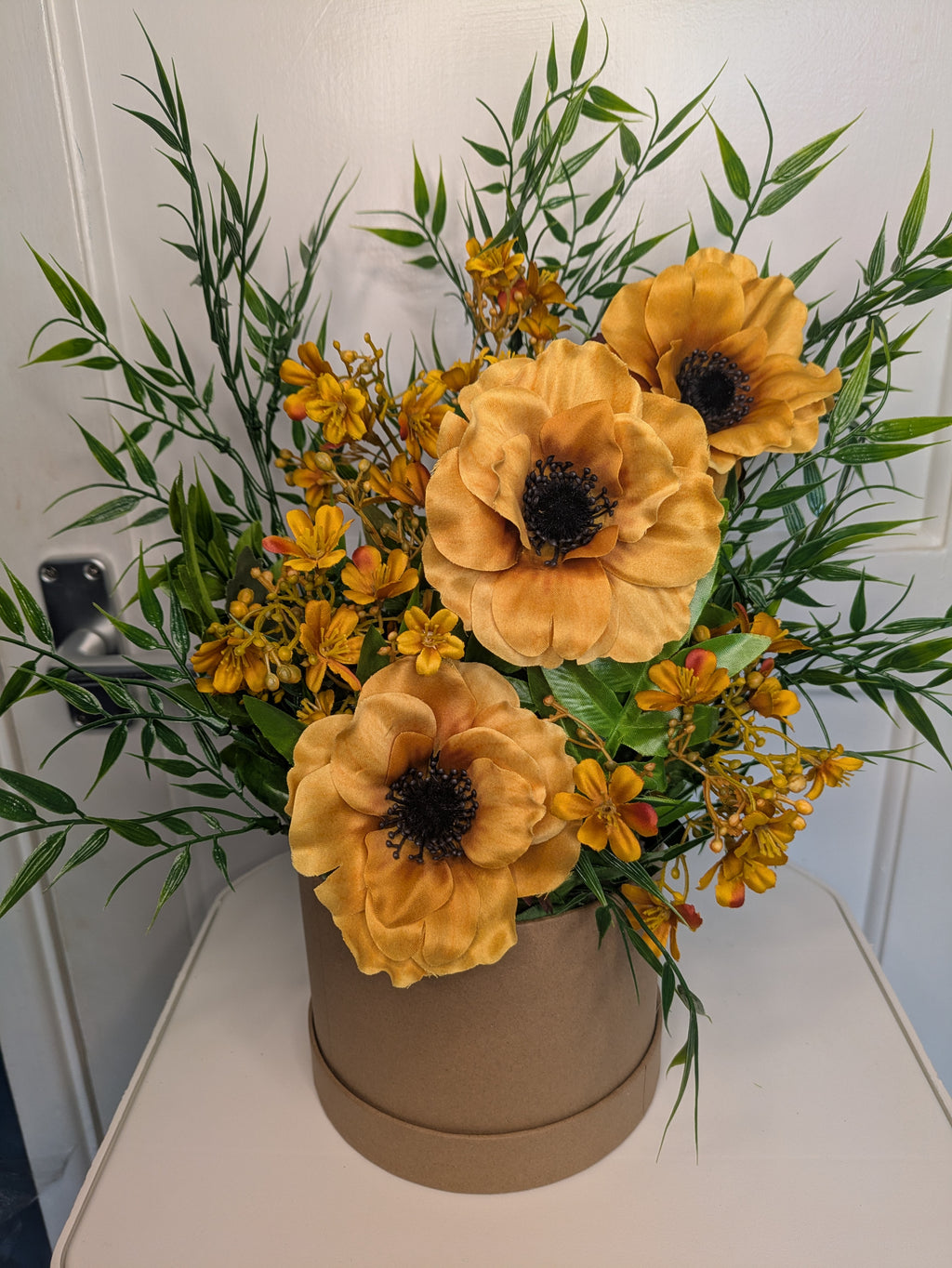 Mustard yellow hatbox arrangement
