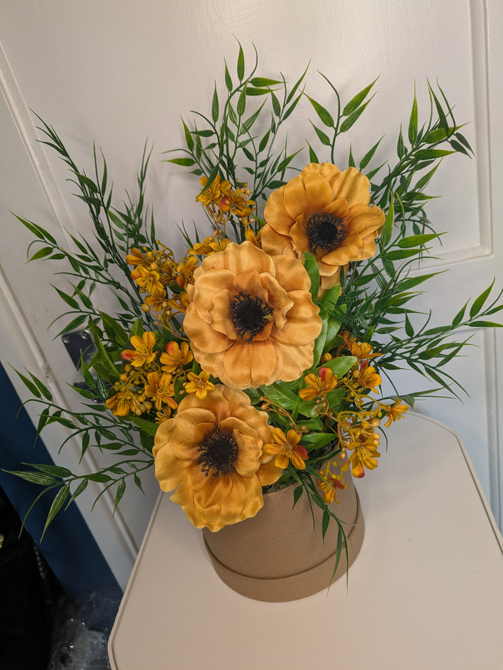 Mustard yellow hatbox arrangement