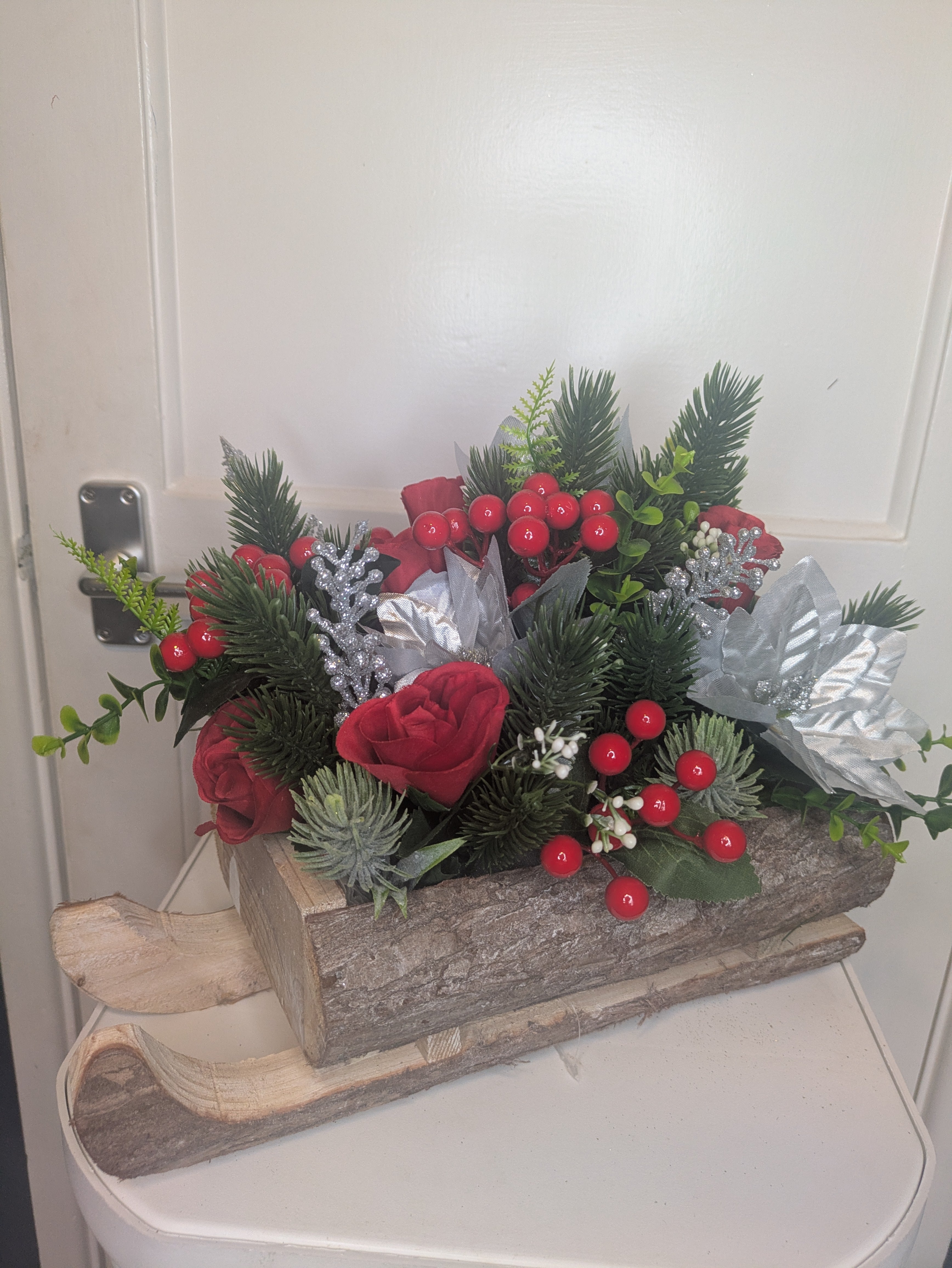 Red, silver and green Sledge Arrangement