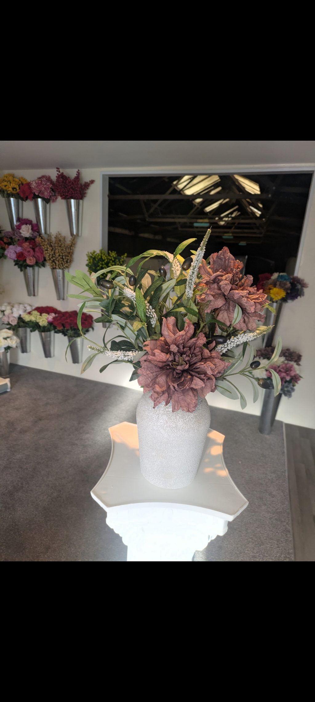 Concrete effect vase with neutral arrangement