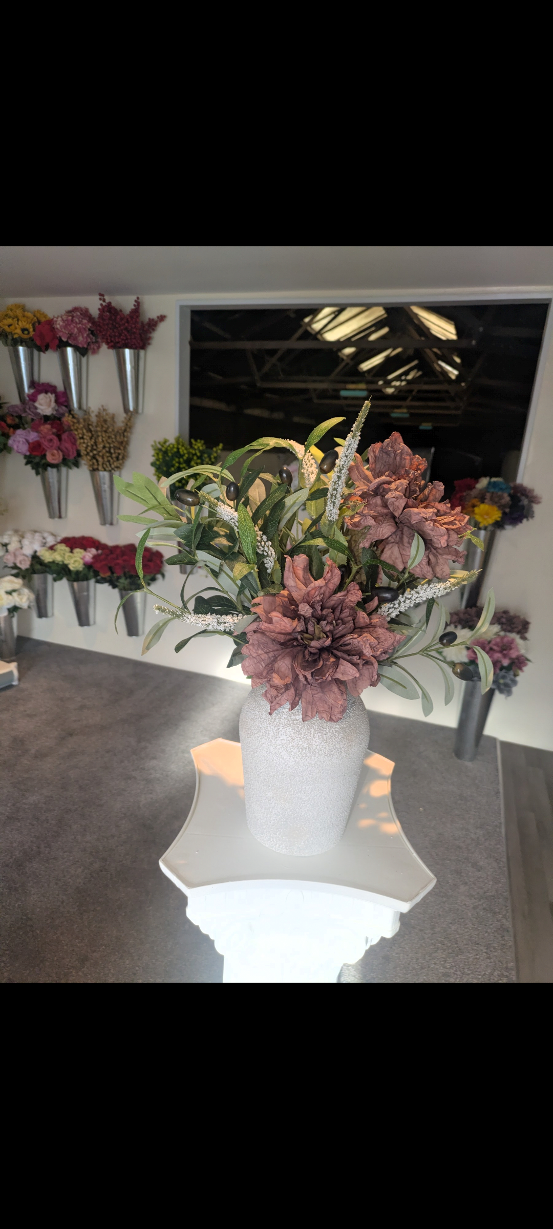 Concrete effect vase with neutral arrangement